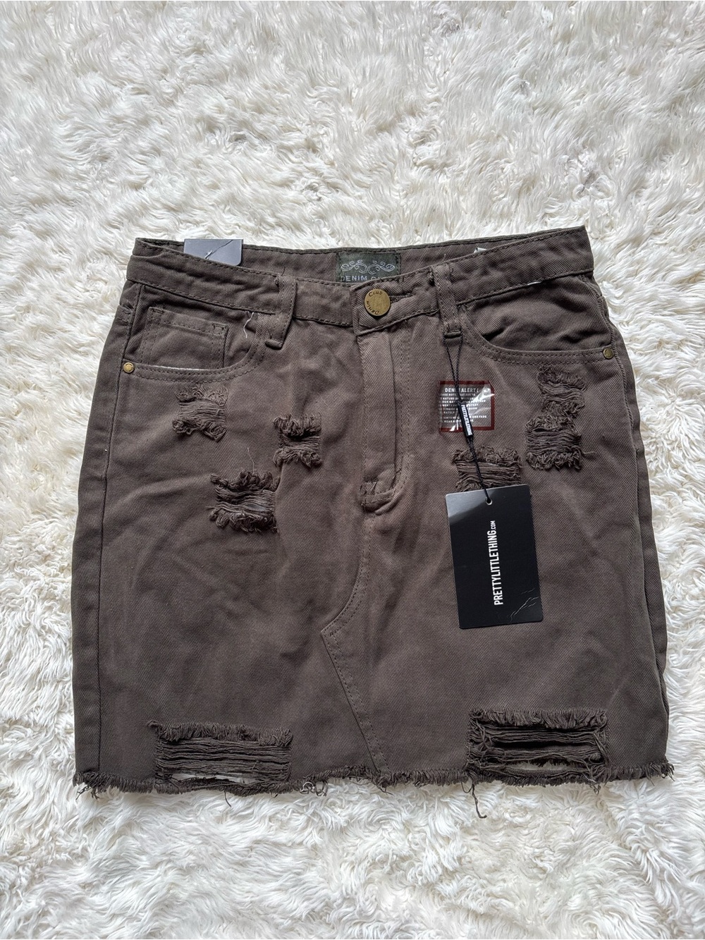 PrettyLittleThing Distressed greenish/brown Denim Mini Skirt